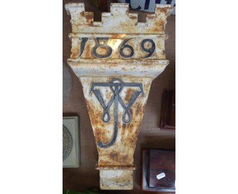 A Victorian cast-iron water hopper with castellated rim, monogrammed, and dated 1869, height 49cm 