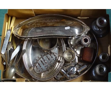 A box containing a silver plated oval galleried tea tray, a chamber stick, cutlery etc 