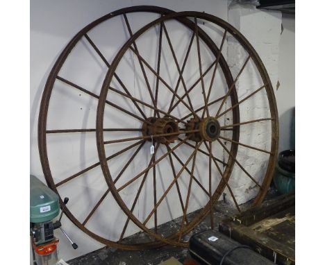A pair of large Vintage cast-iron 16 spoke cartwheels, W140cm 
