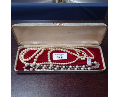 A 2-colour pearl necklace with silver clasp, a single-strand pearl necklace with 14ct gold clasp, and a double-stand pearl ne