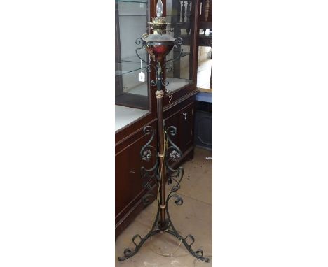 A Victorian scrolled wrought-iron telescopic oil lamp converted to electric 