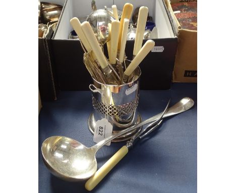 A large silver plated ladle, ivorine-handled cutlery with silver collars, bottle stand etc 
