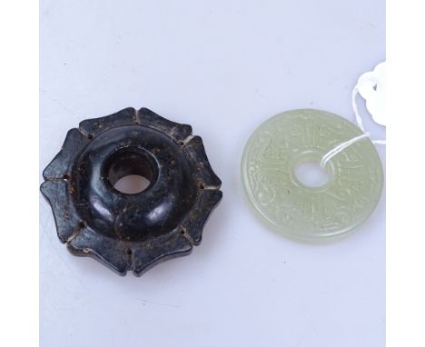 A carved jade pendant, 5cm, and a carved hardstone pendant 