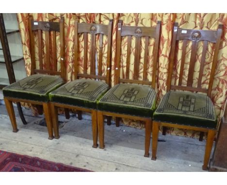 A set of 4 Art Nouveau walnut dining chairs, with original decorative seats 