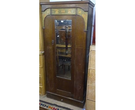 An Art Nouveau oak single mirror door wardrobe, with stylised inlaid decoration, W90cm 