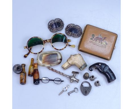 Vintage walking stick handles, sunglasses, a snuff box, and other interesting items 