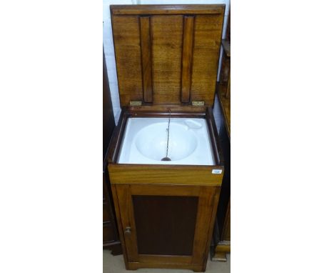 A 20th century mahogany washstand, the rising top revealing a fitted ceramic sink, with cupboard under, W48cm 