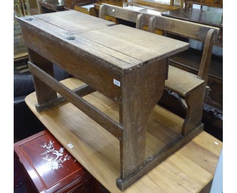 A Vintage oak child's double school desk, W102cm 