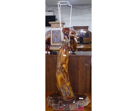 A polished fossilised wood table lamp, height to top of bayonet 64cm 