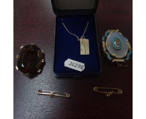 A gilt-metal moonstone and turquoise set brooch with hair panel, an unmarked yellow metal and pearl set bar brooch, a silver 