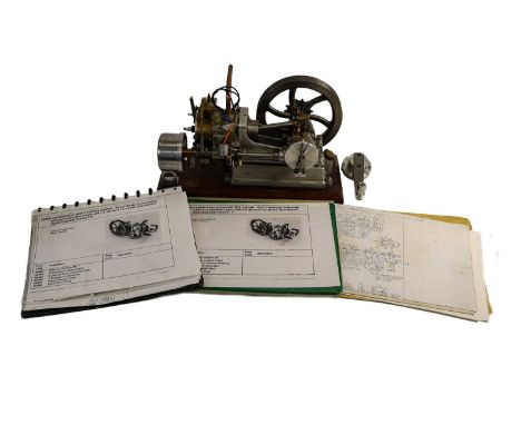 horizontal combustion engine with 1.5" diameter borex2" stroke, on wooden stand with drawings15", 38cm