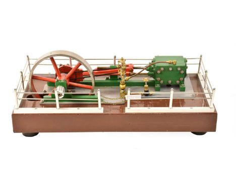 with single cylinder, single flywheel and brass governor, mounted on raised base with railing surround 18x8", 46x20cm