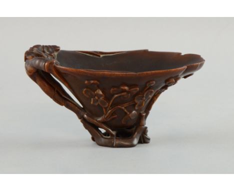 Chinese rhino horn libation cup, the horn of deep toffee tone, carved with branches and blossom, 16 cm x 8 cm high, 169 grams