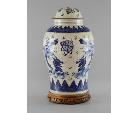 Chinese baluster shaped  blue and white jar and cover decorated with dragons and clouds in 18th century style, Kang Xi six ch