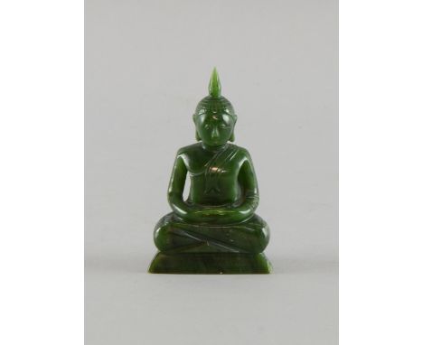 Carved Far Eastern dark green jade figure of a seated Buddha 11cm high, 