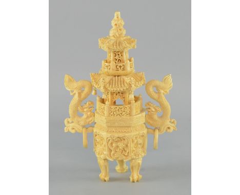 Chinese carved Ivory temple vase decorated with dragons with ring handles and resting on carved feet. 20cm 