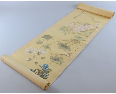 Chinese scroll depicting blossoming plants, with calligraphy and red stamp mark, image size 105cm x 28cm, Discolouration and 