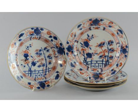 Five Chinese porcelain plates decorated in the Imari palette with flowering shrubs and bamboo, 22.5cm diameter, All with glaz