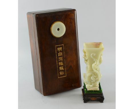 Chinese pale celadon jade vase of GU form with relief carving of five dragons, on carved hardwood stand, in fitted case with 