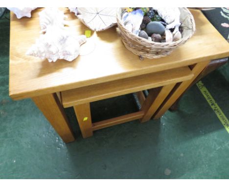 NEST OF TWO LIGHT OAK OCCASIONAL TABLES.