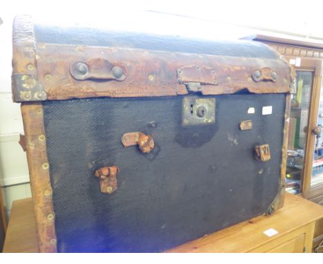 EARLY 20TH CENTURY LEATHER AND CANVAS CLAD DOMED TRAVEL TRUNK. (AF)