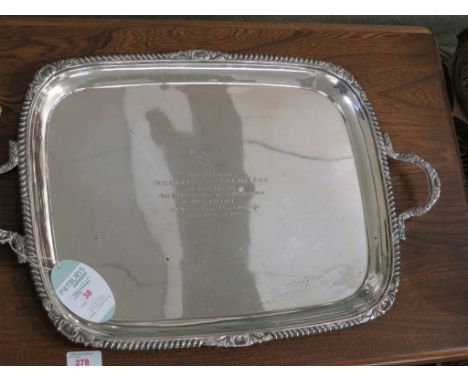 AN OBLONG TWO-HANDLED SILVER TRAY WITH GADROONED EDGE AND FOLIATE MOULDING, WITH PRESENTATION ENGRAVING TO BRIGADIER GENERAL 