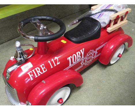 VINTAGE STYLE CHILDREN'S RIDE ON CAR IN FORM OF A FIRE ENGINE. (SOLD AS DECORATIVE ITEM ONLY)