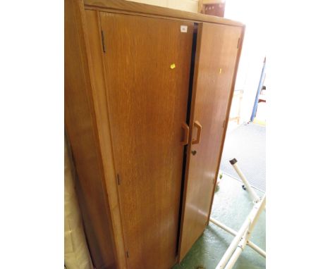 MID 20TH CENTURY LIGHT OAK  TWO-DOOR FITTED WARDROBE.