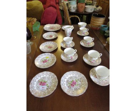 BONE CHINA SIX SETTING TEA SERVICE WITH GILT AND FLORAL DECORATION.