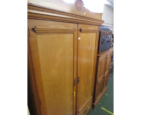 EDWARDIAN LIGHT OAK TWO-DOOR WARDROBE WITH BRASS HANDLES.
