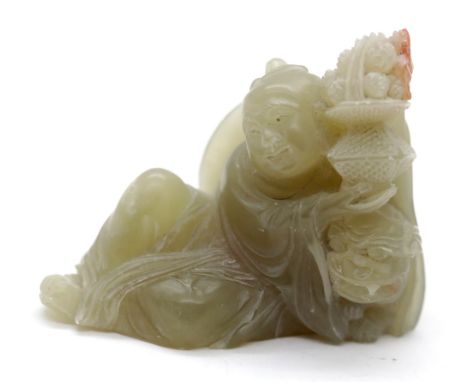 Carved jade Buddha holding a lamp, H: 6 cm. P&amp;P Group 1 (£14+VAT for the first lot and £1+VAT for subsequent lots) 