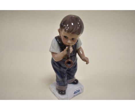 A Dahl Jensen Copenhagen, Denmark figurine,boy with pipe,gloss finish.