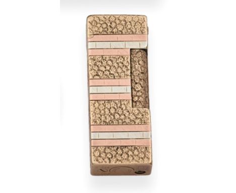 A 9ct Three Colour Gold Cased Rollagas Lighter, Alfred Dunhill, London 1981, with alternating textured and brick decoration, 