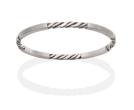 A Silver Georg Jensen Bangle, model number 17C, of twisted and plain bar design, measures 6cm by 5.5cm inner diameter see ill