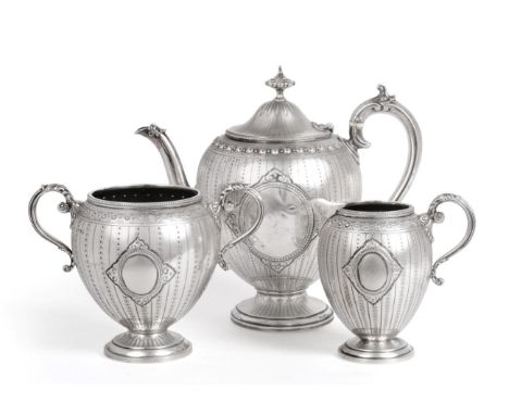 A Matched Victorian Silver Three Piece Tea Service, Marks of Messrs. Barnard and Henry William Curry, London 1872 and 1882, o