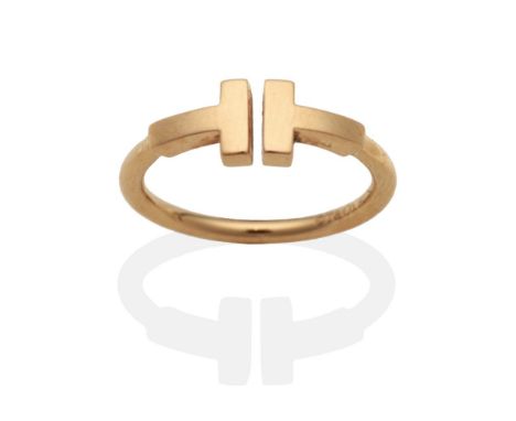 An 18 Carat Gold Tiffany & Co 'T Wire' Ring, finger size K, boxedThe ring is in good condition. It is hallmarked with maker's