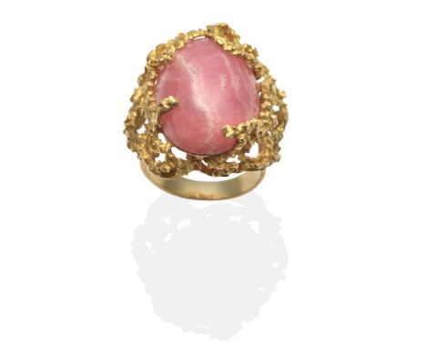 A Rhodochrosite Statement Ring, an oval cabochon rhodochrosite in a textured setting, finger size L1/2 see illustration  The 