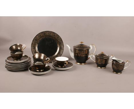 A Japanese 'Sone China' tea set with 12K gold gilt decoration. Comprising of teapot, five cups, six saucers, sugar bowl and m