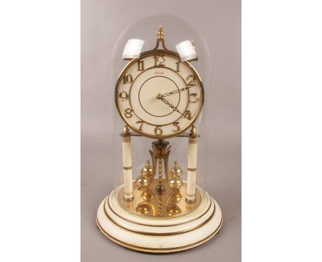 A Kieninger &amp; Obergfell Kundo torsion clock under glass dome. (30cm).  