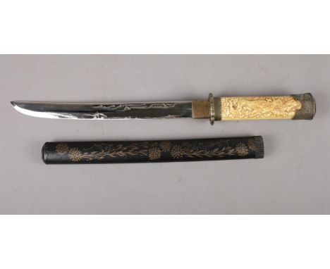 A reproduction Japanese Wakizashi short sword. (28cm blade). Dragon decoration to the handle and gilt decorated scabbard. Tot