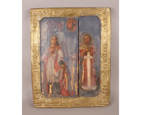 An interesting religious icon on period panel, with later brass frame. (43cm x 34cm).  Flaking to paint.