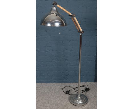 A large chrome angle poise standard lamp.  Snap to metal on shade attachment.
