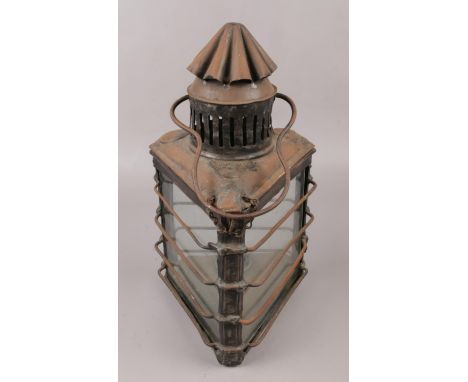A 19th century oil lantern of triangular form, by John Evitt London.  Chip to bottom edge of one glass panel. Generally good 
