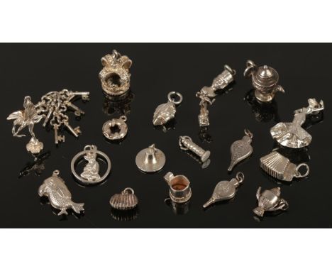 20 silver charms. Including figures playing instruments, bellows examples, etc. 40g.  