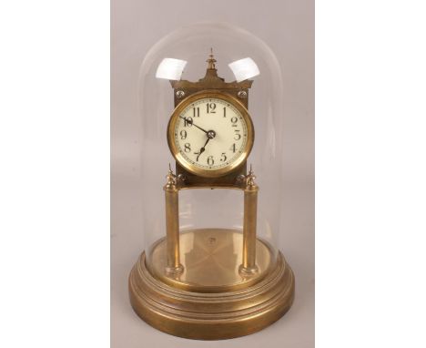 A Gustav Becker brass torsion clock under glass dome. (approximately 29cm).  Missing pendulum.