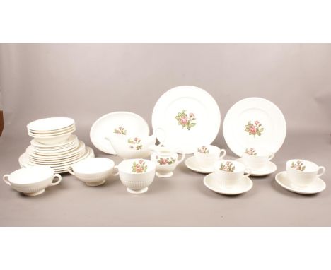 A collection of Wedgwood 'Moss Rose' patterned dinner and tea ware. (34 pieces). Comprising of four dinner plates, four cups 