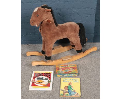 An A&amp;A soft toys rocking horse along with metal toys guide book, etc.  