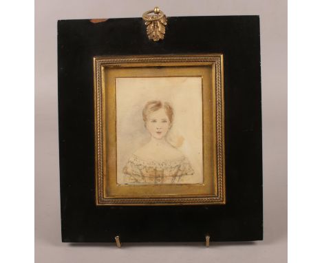 A 19th century portrait miniature in ebonised frame. Sketch of a girl on paper (9.5cm x 7.5cm). Inscribed to the back.  