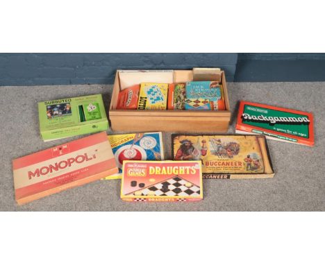 A box of vintage board games. Including monopoly, Subbuteo, frustration, etc.  