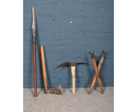 A collection of vintage maintenance tools. To include: axe, hedge slasher and pick axe etc. Longest item: 110cm.  Handle of t
